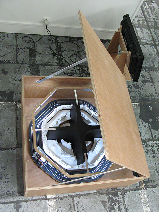 Henrik Menné: Landsskab efter hukommelse (Landscape according to menmory). 2008, model train, camera, screen, aluminium and wood, approx 200x100x100 cm