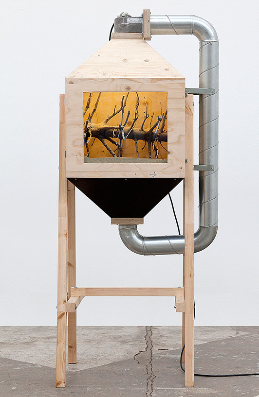 Henrik Menné: Savsmuldsinstrument (Saw Dust Instrument). 2012, board, plywood, pine tree, saw dust, metal, ventilator, cable, 193 x 83 x 68 cm