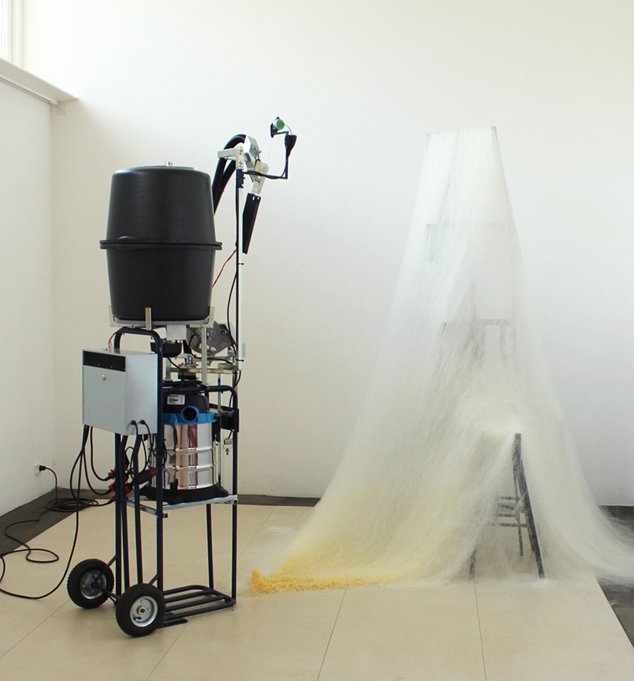 Henrik Menné: Multi Power 90L, 2017, Vacuum cleaner, mailbox, hand truck, grill spear engine, mason vats, fan, iron and electronics, 210 x 80 x 60 cm