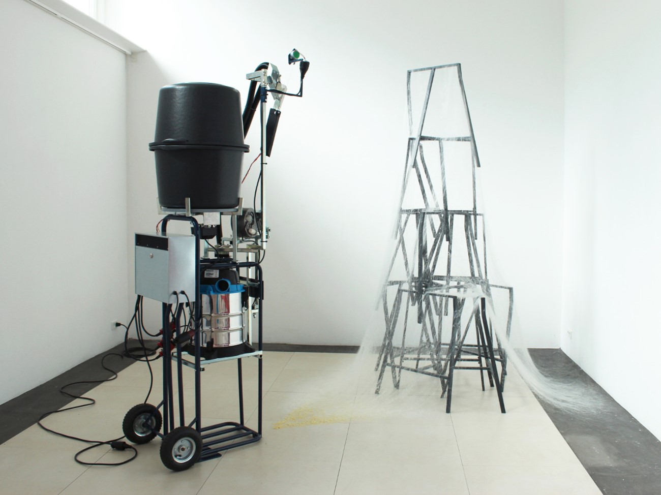 Henrik Menné: Multi Power 90L (1), 2017, Vacuum cleaner, mailbox, hand truck, grill spear engine, mason vats, fan, iron and electronics, 210 x 80 x 60 cm