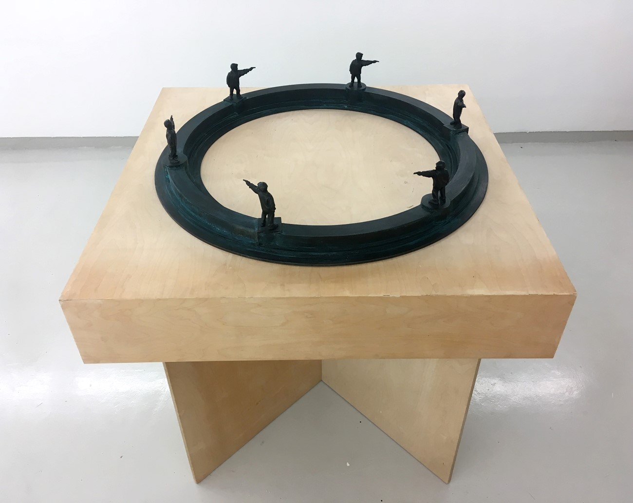 Øivind Nygård: Boy on circle shooting boy on square, 2001, Dark patinated bronze and birch veneer, 132 x 128 x 128 cm